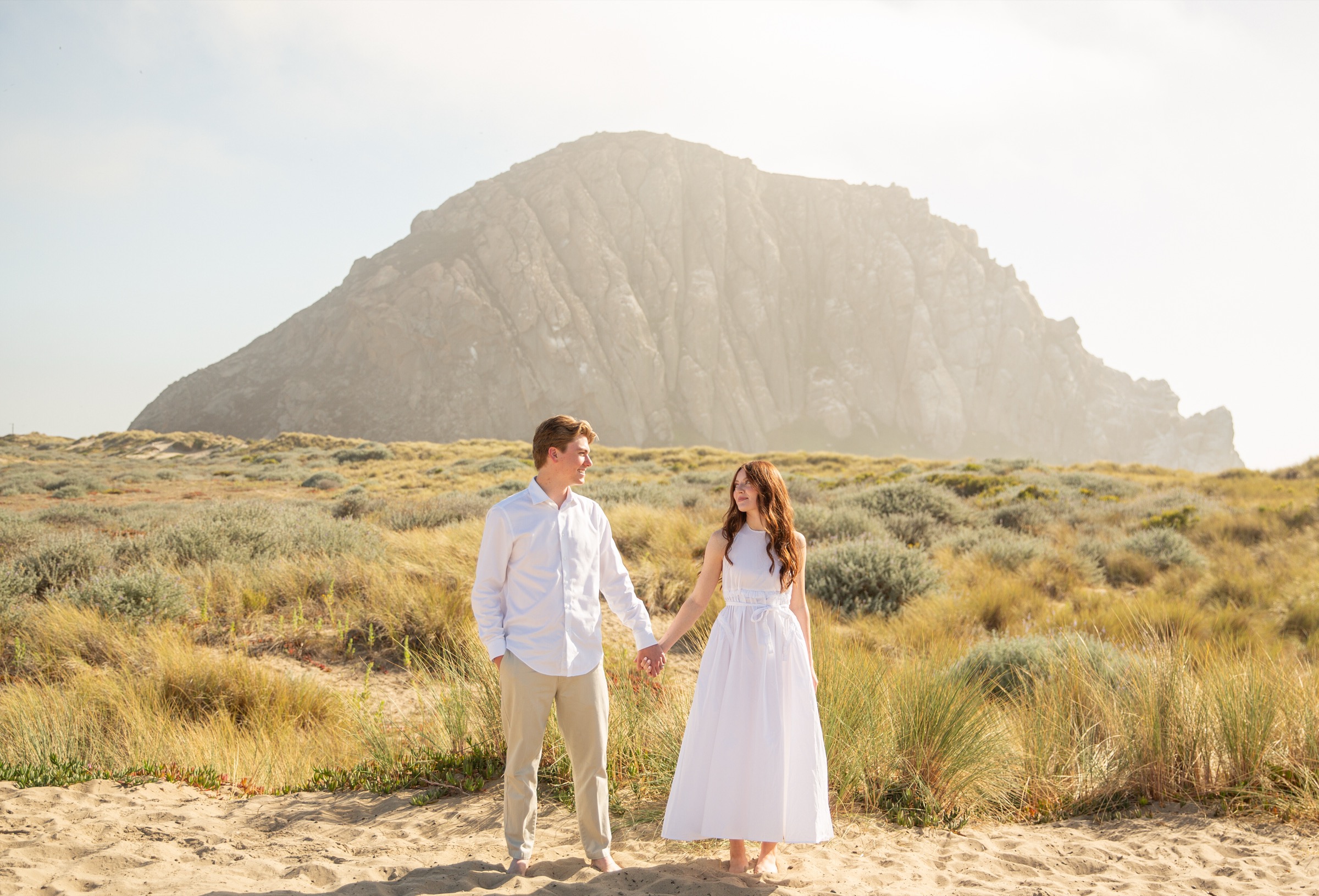 Bridget and Cole in front of the coastal rock